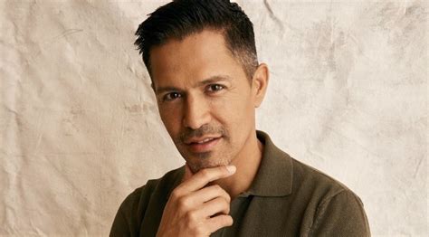 Magnum Pi” Star Jay Hernandez Poses In Front Of Season 5 Billboard