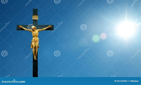 Jesus Christ On The Cross Over Blue Sky Background Stock Photo Image