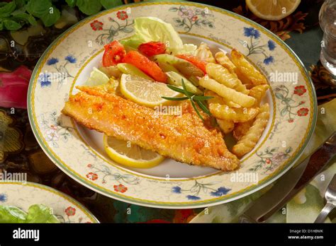 Fish baked with herbs Stock Photo - Alamy