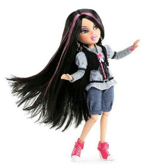 A Doll With Long Black Hair And Pink Shoes Is Standing On A White