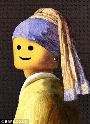 A Lego Man With A Pearl Ear And A Smile On His Face Wearing A Yellow Shirt