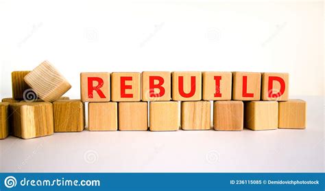 Rebuild And Build Symbol The Concept Word Rebuild On Wooden Cubes