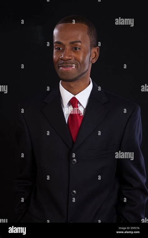 Black Man In Dark Suit White Shirt And Red Tie A Successful