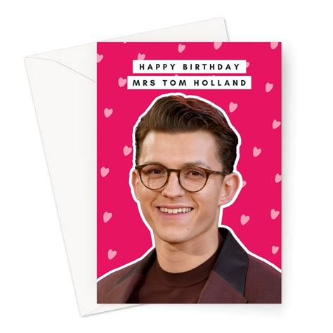 a birthday card with a photo of a man wearing glasses and hearts in the background