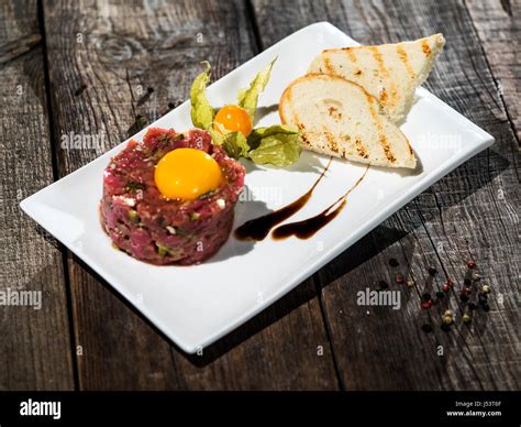 Raw Steak Tatar With Egg Yolk Stock Photo Alamy