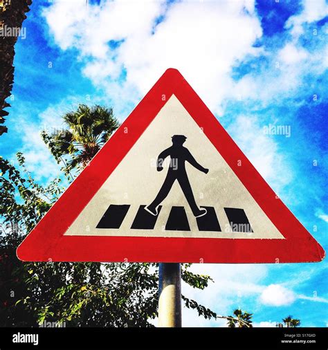 Pedestrian crossing road sign Stock Photo - Alamy