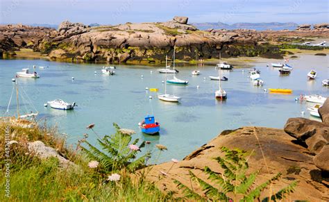 Brittany France Boats And People At Pink Granite Coast During Low