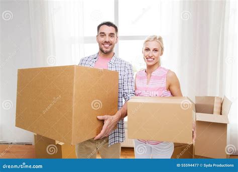 Couple With Big Cardboard Boxes Moving To New Home Stock Image Image