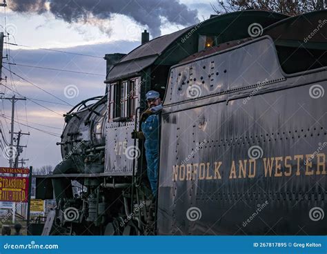 View of a Classic Steam Passenger Train Arriving into a Train Station ...