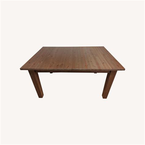 IKEA Extendable Dark Wood Dining Table - AptDeco