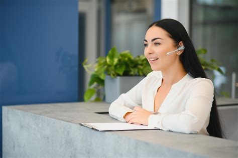 Premium Photo Portrait Of Beautiful Receptionist Near Counter In Hotel