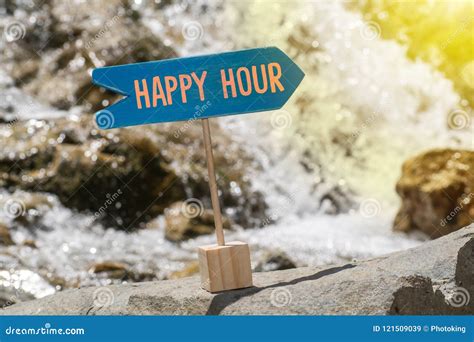 Happy hour board on rock stock image. Image of difficulty - 121509039