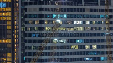 Windows Illuminated At Night In Modern Office Buildings Timelapse