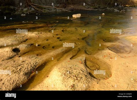 Potholes in a river bed Stock Photo - Alamy