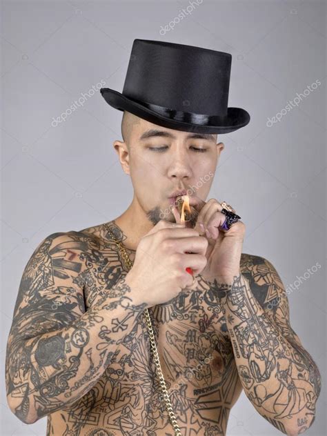 Man with tattoo smoking — Stock Photo © kozzi2 #17434953