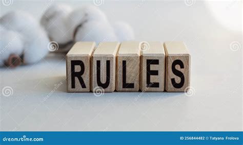 The Inscription RULES On Wooden Cubes Isolated On A Light Background