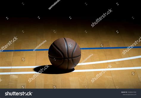 Basketball On Hardwood Court Floor Spot Stock Photo 1828041032