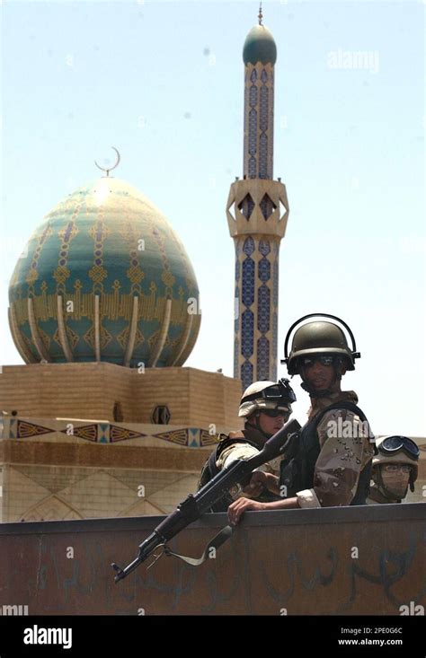 Iraqi Soldiers Walk A Foot Patrol In Front Of The Ibn Bunniyah Mosque