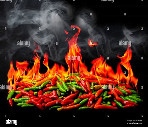 Group Of Red Hot Chili Pepper On Fire And Smoke At Black Background