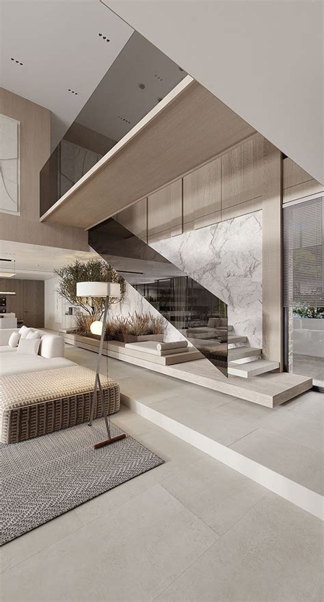 A Modern Living Room With Stairs Leading Up To The Second Floor And An