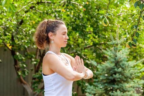 Young Woman Practices Yoga in the Summer Garden - Namaskar Mudra Stock ...