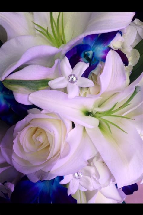 White Lillies White Roses Blue Dendrobium Orchids And Stephanotis