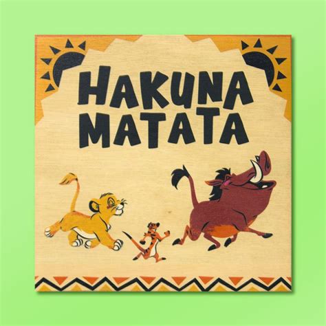 A Wooden Sign With The Words Hakuna Matata On It