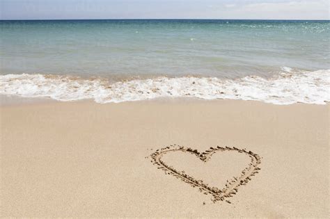 Portugal View Of Heart Shape In Sand Stock Photo