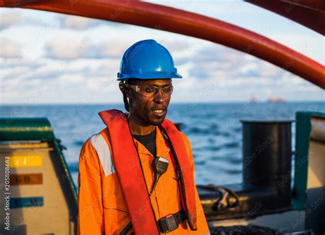 Seaman Ab Or Bosun On Deck Of Vessel Or Ship Wearing Ppe Personal Protective Equipment