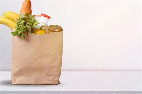 Premium Photo Various Grocery Items In Paper Bag On Table Bag Of