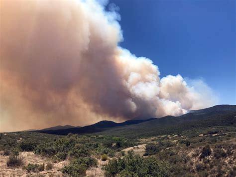 Some Arizona wildfire evacuations lifted, weather improves