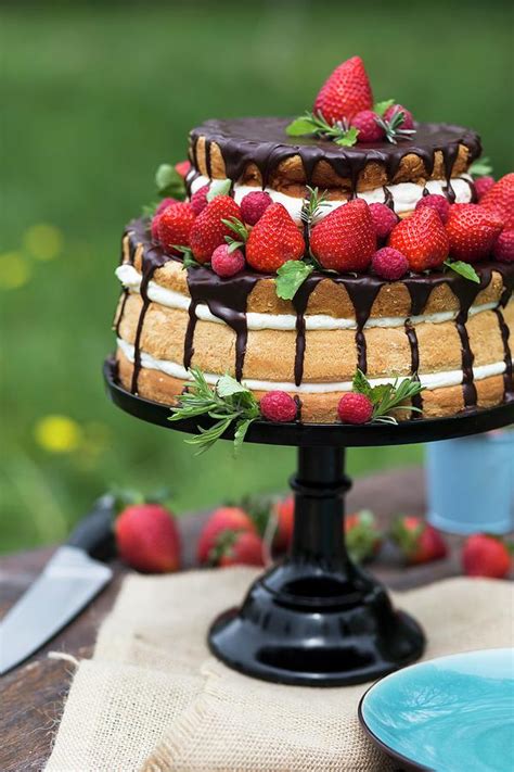 A Naked Cake With Strawberries Cream And Chocolate Glaze Photograph By