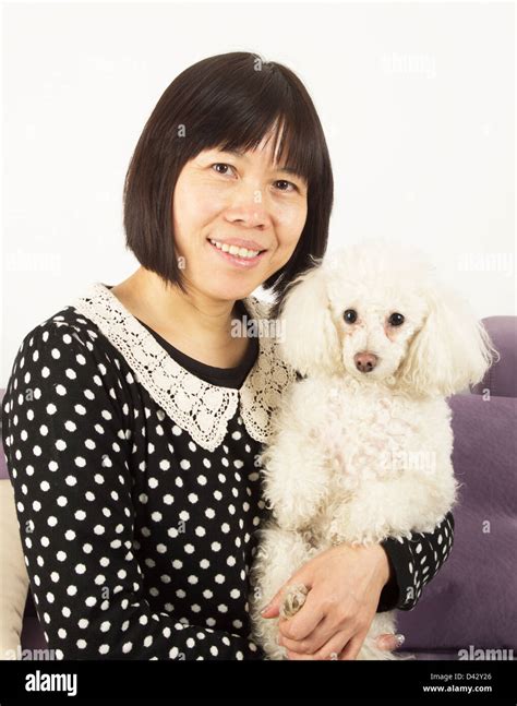 Woman Holding Poodle Hi Res Stock Photography And Images Alamy