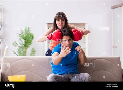 Wife Unhappy That Husband Is Watching Boxing Stock Photo Alamy