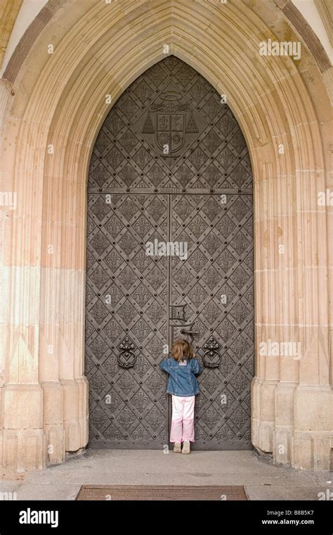 Girl 5 Years Old In Front Of A Big Church Door Wroclaw Poland Stock