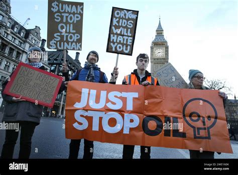 Protesters Hold Up Placards And Stand Behind A Just Stop Oil Banner