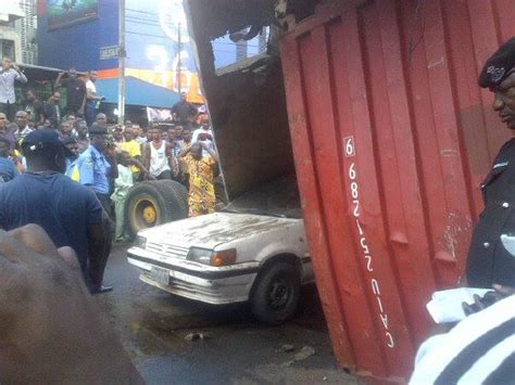 Photos Video Clip Of How Truck Container Fell Off Ojuelegba Bridge