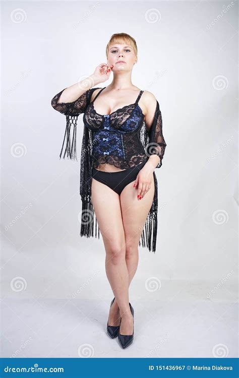 Plus Size Woman With Short Hair In Blue And Black Lace Corset Lingerie