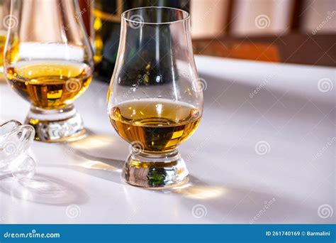 Tasting Of Whiskey Tulip Shaped Tasting Glasses With Dram Of Scotch