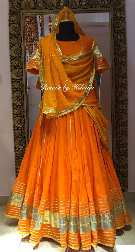 Traditional Rajputi Poshak With Assi Kali Ka Lehenga In Orange Color