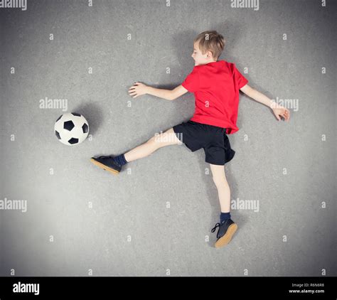 Boy From Above Playing Soccer Ball Stock Photo Alamy