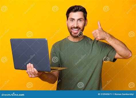 Photo Portrait Of Attractive Young Man Hold Netbook Show Thumb Up Wear