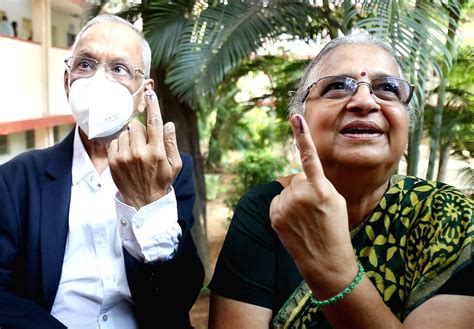 Bengaluru Infosys Founder N R Narayan Murthy And His Wife Sudha Murthy After Casting Their