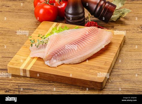 Raw Tilapia Fish Fillet For Cooking Stock Photo Alamy