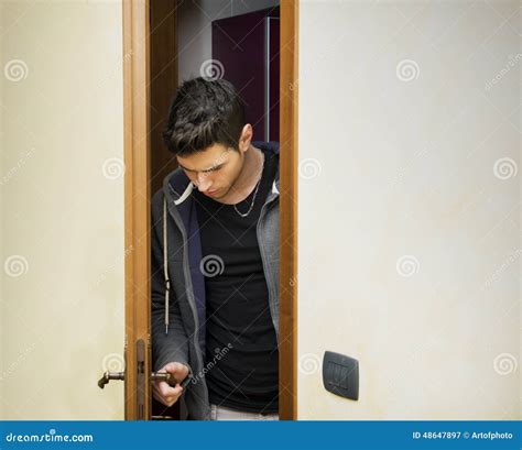 Handsome Young Man Opening Door To Enter Stock Image Image Of Doorway