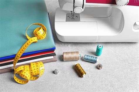 Premium Photo Set Of Tailoring Tools Fabric And Sewing Machine On Table