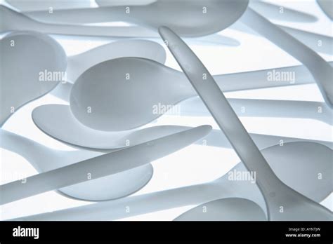 White Plastic Spoons Stock Photo Alamy