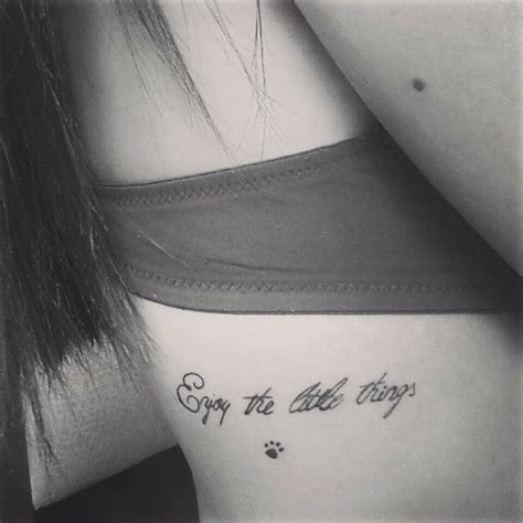 Side tattoo saying "Enjoy the little things" together