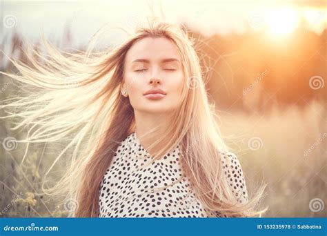 Portrait Of Beauty Girl With Fluttering White Hair Enjoying Nature