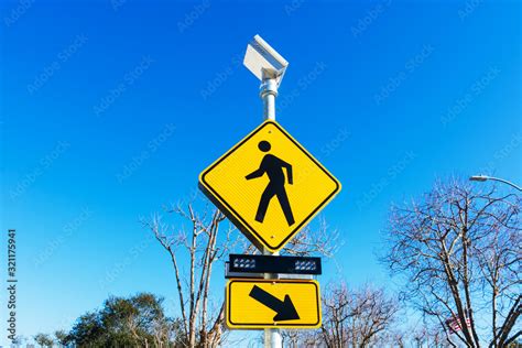 Pedestrian crossing sign with solar powered flashing lights. Crosswalk ...